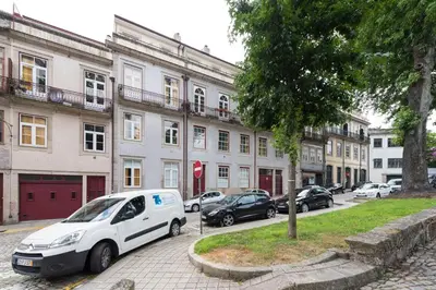 a white van parked in front of a building at LovelyStay - The Porto Getaway w/ Free Parking in Porto