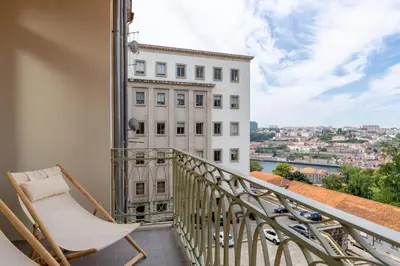 a counter with three bottles of oil and a blender at Tripas-Coração, Cordoaria River View, Garden View or Loft in Porto