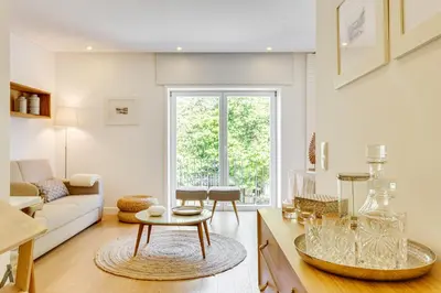 a living room with a couch and a table at Wood Premium Downtown Apartment by DA'HOME in Porto