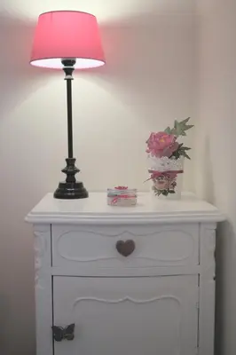 a white dresser with a lamp and flowers on it at Architect House in Porto