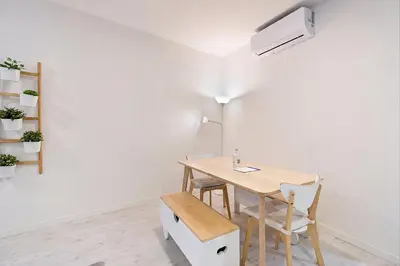 a bedroom with a bed with white sheets and a window at FindMe InPorto Santa Catarina in Porto