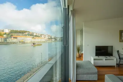 a large bedroom with two beds and a large window at LUXURY VIEWS by YoursPorto in Vila Nova de Gaia