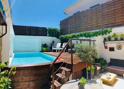 a bedroom with a bed and a table at Boreal Porto Gaia - Patio & Pool in Vila Nova de Gaia