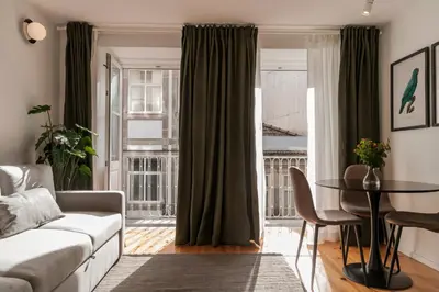 a living room with a couch and a table at Porto Historical Center Apartments in Porto