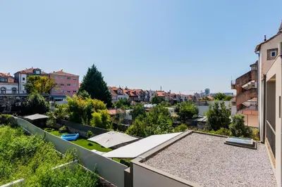 a roof garden with a view of a city at Boavista Garden Apartment in Porto