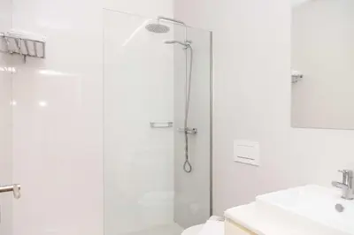 a bathroom with a shower and a toilet and a sink at VIVA Size Flats Clérigos in Porto