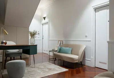 a living room with a desk and a chair at Trindade Premium Apartments in Porto