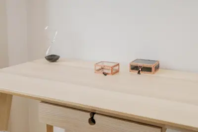 two small wooden boxes sitting on top of a table at BOUTIQUE Rentals-Kihara’s Ribeira Apt with great views in Porto