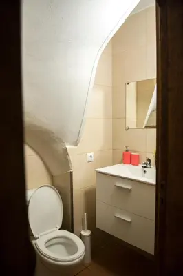 a small bathroom with a toilet and a sink at Vivenda Center Porto in Porto