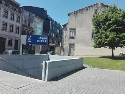 a sign on the side of a city street at St. Johns Alley of Poetry and Imaginary Cats in Porto