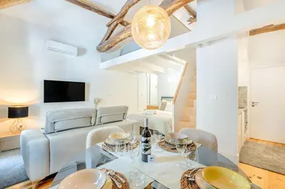 a white bathroom with a toilet and a shower at Santa Catarina Charming Loft in Porto