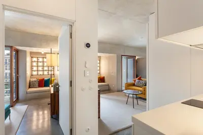 an open kitchen and living room in a apartment at S.Bento Residences in Porto