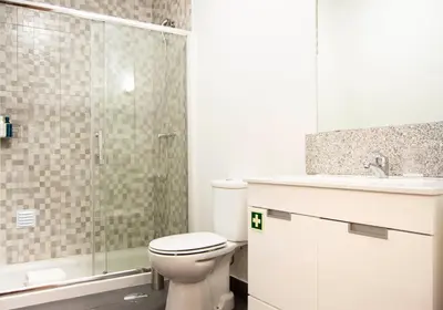 a bathroom with a toilet and a sink and a shower at Old City Oporto in Porto