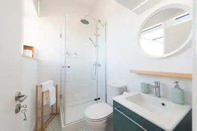 a bathroom with a toilet and a sink and a shower at Oporto Dinis Apartment - Rooftop in Porto