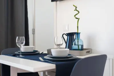 a table with two wine glasses and a blue table cloth at Oporto Dinis Apartment - Rooftop in Porto