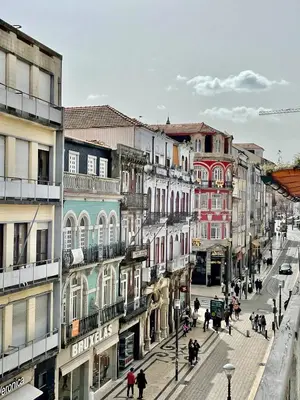 a busy city street with people and buildings at Santa Catarina Guest House (Porto city center) in Porto