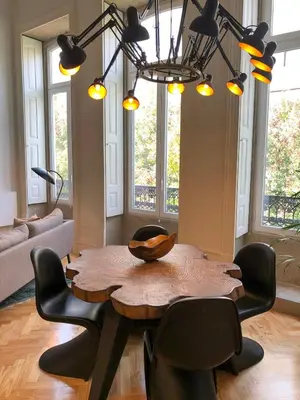 a living room with a wooden table and chairs at Oporto Chic&Cozy - Ateneu in Porto