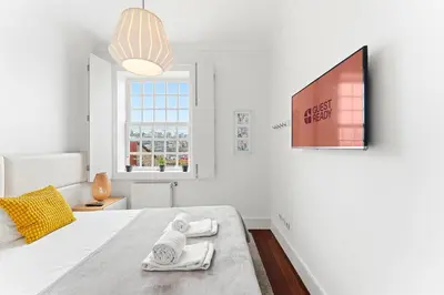 a living room with a couch and a table at GuestReady - Ribeira Apt in Porto center in Porto