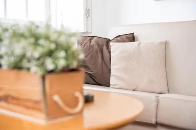 a living room with a couch and a painting on the wall at GuestReady - Ribeira Apt in Porto center in Porto