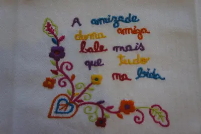 a towel with a painting of a flower on it at Alfandega Apartments in Porto