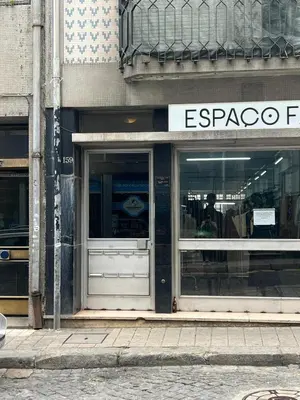 a store front with the door open on a city street at OPORTO APARTMENT LUXURY in Porto