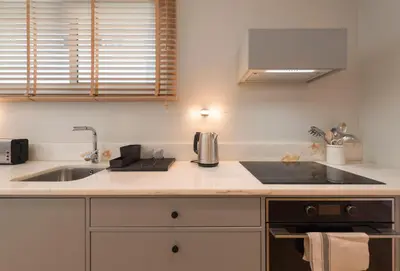 a kitchen with a sink and a counter top at Ceuta 33 Apartment in Porto