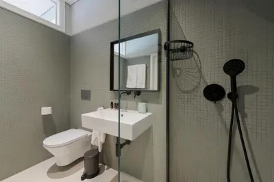 a bathroom with a toilet and a sink and a shower at Ceuta 33 Apartment in Porto