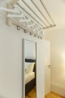 a mirror in a room with a bed at Loft da Sé by Porto City Hosts in Porto
