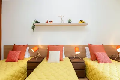 a room with two couches with lamps on them at Host Wise - Deluxe Bright Flat with Netflix in Porto