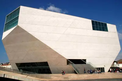 a large white building with people standing outside of it at ! Free Parking Street ! Ground Floor with Washer! in Porto