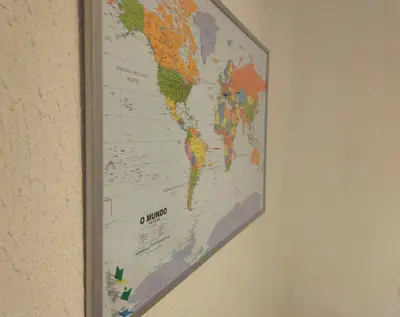 a map of the world hanging on a wall at ! Free Parking Street ! Ground Floor with Washer! in Porto