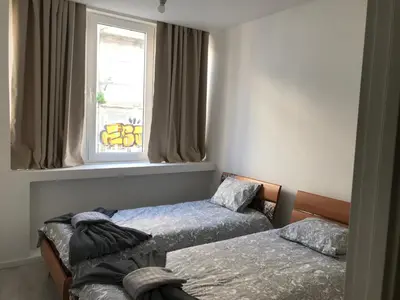 a bedroom with two beds and a window at City Heart Place 1 in Porto