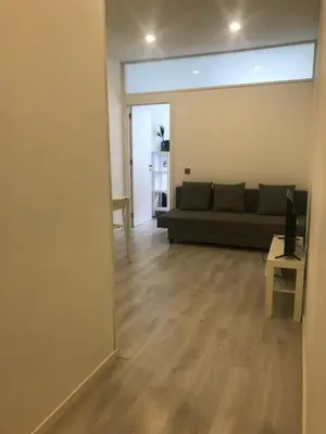 a living room with a couch and a table at City Heart Place 1 in Porto