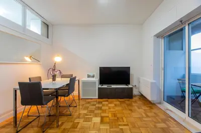 a living room with a table and a television at Casa da Alegria- Downtown by Oporto Soul in Porto