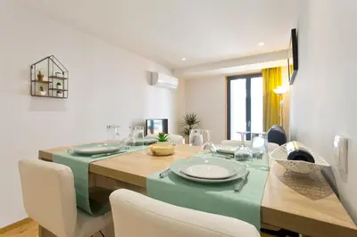 a dining room with a table and chairs at Charming Apartment in Porto - 50 m² - Modern Comfort in Porto