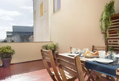 a table on a balcony with food on it at Oporto Classic Pàtio in Porto