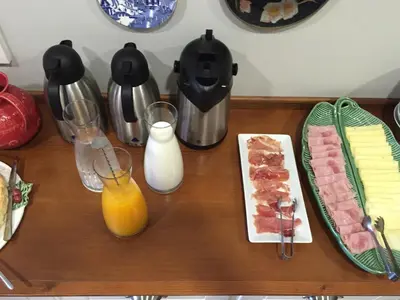 a table with food and drinks on top of it at B The Guest Downtown in Porto
