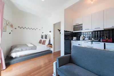 a bedroom with a bed and a couch in a room at All in flat by, city center, skyline in Porto