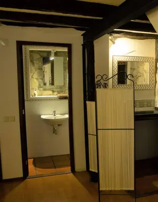 a bathroom with a sink and a mirror at Cosy apartment in Porto city centre – 50 sqm with parking in Porto