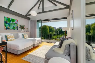 a living room with two beds and a couch at Luxury Old Town Oasis for Family and Friends (Daily Breakfast + Housekeeping incl) in Porto