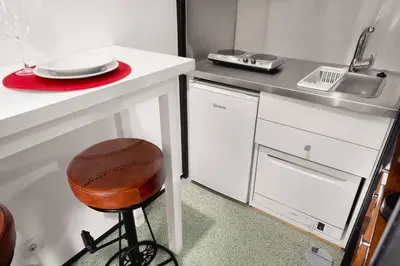 a small kitchen with a bike in a room at Porto National Theatre Trendy Houses in Porto