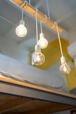 a group of lights hanging from a ceiling at CASA DOURO Porto City in Porto