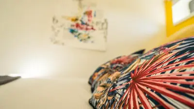 a close up of a pillow on a bed at CASA DOURO Porto City in Porto