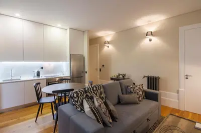 a living room with a couch and a table at Tailor's Apartment in Porto