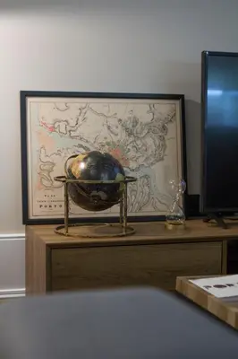 a bowl sitting on a table next to a monitor at Tailor's Apartment in Porto