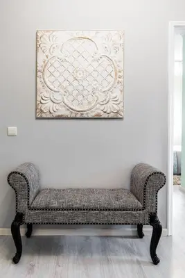 a couch in a room with a picture on the wall at Metropolitan Gaia-Porto in Vila Nova de Gaia