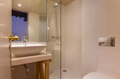 a bathroom with a sink and a shower at The Art Porto - Holiday Homes in Porto