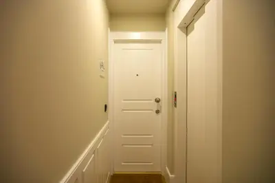 a hallway with a white door in a room at Charming Studio in Historic Downtown in Porto