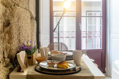 a table with a plate of food on top of it at Oldtown Studio in Porto