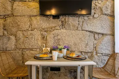 a white table with two plates of food on it at Oldtown Studio in Porto